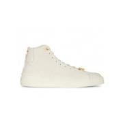 Balmain Vita höga sneakers med monogrammönster och guldlogotyp Beige, ...