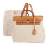 Hermès Vintage Pre-owned Canvas handvskor Beige, Dam