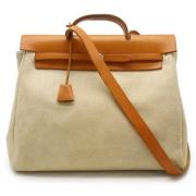 Hermès Vintage Pre-owned Canvas handvskor Beige, Dam