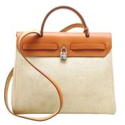 Hermès Vintage Pre-owned Canvas handvskor Beige, Dam